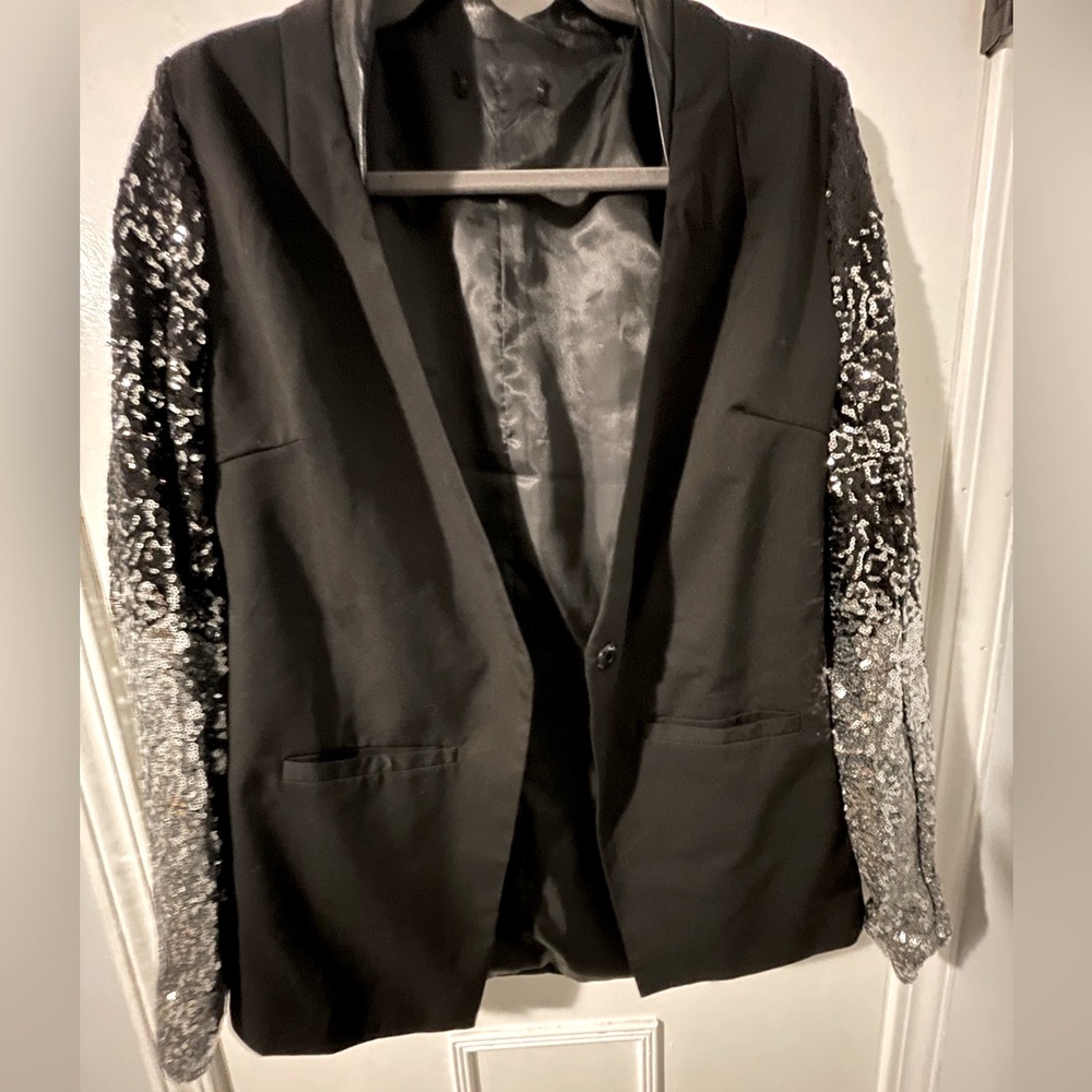 Black blazer with sequin sleeves. Size large. Runs small